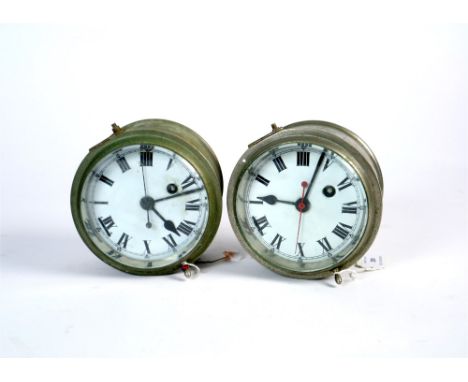 Two General Post Office chrome cased bulk head clocks, the white enamel dials with black Roman numerals, set within hinged ca