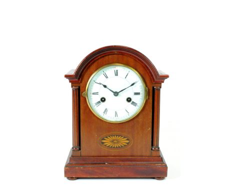 An Edwardian bracket mantle clock, the white enamel 5" dial with black Roman numerals with spade and whip hands flanked by fl