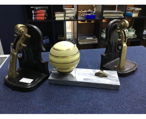 ART DECO STYLE LAMP, with glass spherical shade and marble base, 22cm wide, along with a pair of bookends, each modelled with
