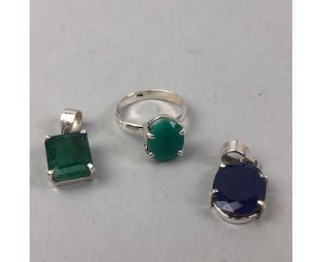 TWO GEM SET PENDANTS AND A RING, including a 14.00 carat sapphire pendant, a 12.00 carat emerald pendant and an 8.00 carat em