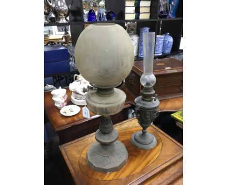 VICTORIAN CAST METAL OIL LAMP, with glass shade, 55cm high, along with another cast metal oil lamp with funnel (2)