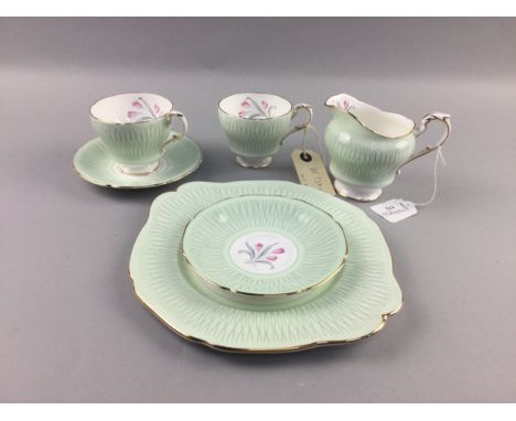 PARAGON HALF TEA SERVICE, decorated with a floral spray, comprising 6 cups, 6 saucers, 6 side plates, milk jug and cake plate