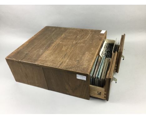 TABLETOP CHEST OF TWO DRAWERS, 38cm wide, along with a travel trunk containing a collection of postcards and an album of ship