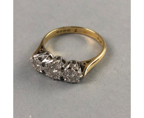 DIAMOND THREE STONE RING, set in eighteen carat gold