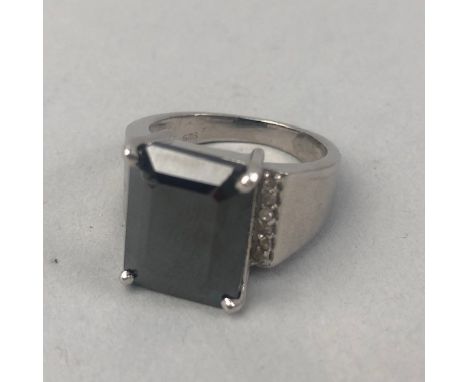 BLACK MOISSANITE RING, with a rectangular moissanite of approximately 10.00 carats, marked 925, size S, 11g and another black