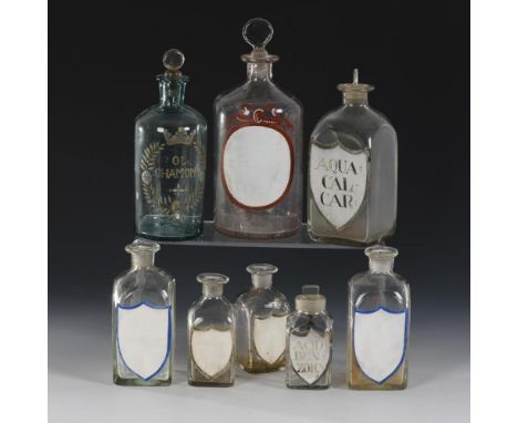 8 Apothekengefäße19. Jh.             Farbloses, 1x bläuliches Glas. H 11-25 cm.             Verschiedene Flaschen, davon 1x m