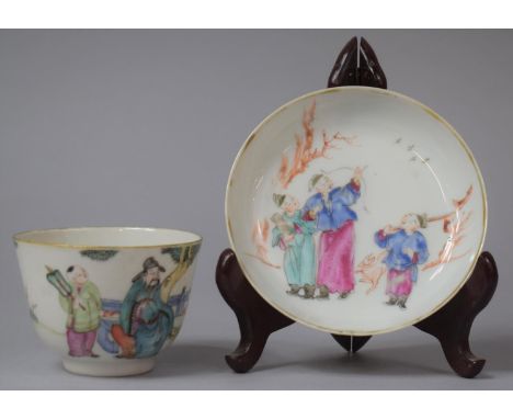 A Chinese Famille Rose Qianlong Porcelain Tea Bowl and Saucer Decorated with Applied Enamels Depicting Seated Dignitary Serve