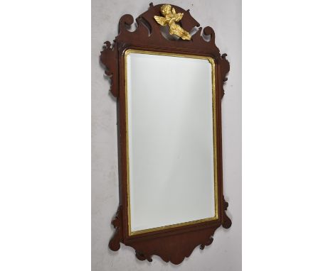 A Mahogany Reproduction Wall Mirror with Gilt Cherub Finial, 114cm x 58 cm 