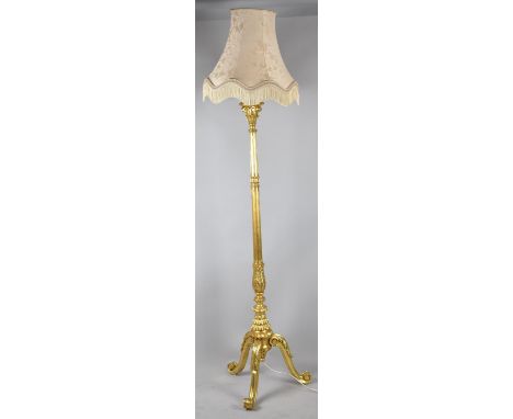 A Gilt Tripod Standard Lamp with Shade 