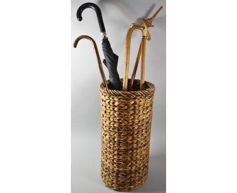 A Cylindrical Stick Stand Containing Four Sticks and an Umbrella, Stick Stand, 49cm High 