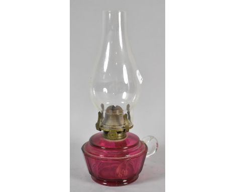 An Edwardian Cranberry Glass Oil Lamp with Plain Glass Chimney, Total Height 29cm 