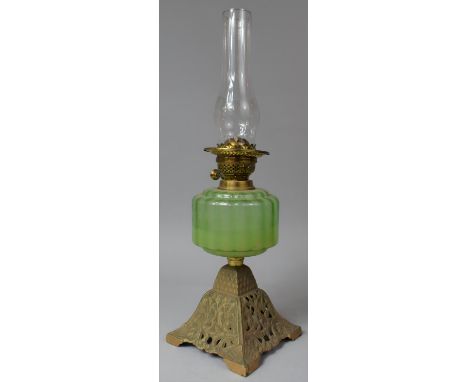 A Late Victorian Brass Based Oil Lamp with Green Glass Reservoir and Duplex Controls, 58cm high Max 