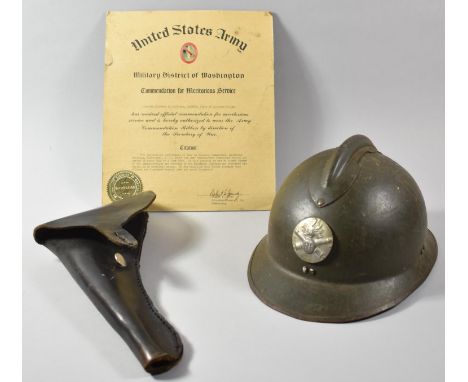 A French WWI Military Helmet with RF Badge, United States Army Commendation for Meritorious Service, Browning Pistols Booklet