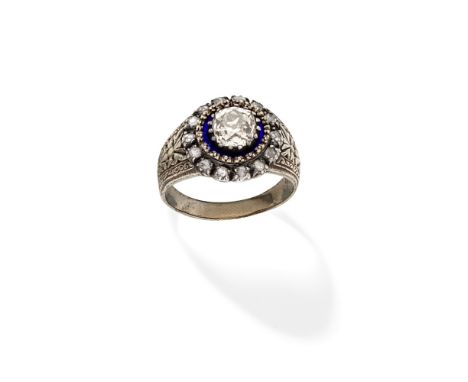 DIAMOND AND ENAMEL RING, FIRST HALF OF 19TH CENTURYSet with a cushion-shaped diamond within a blue enamel frame and a border 