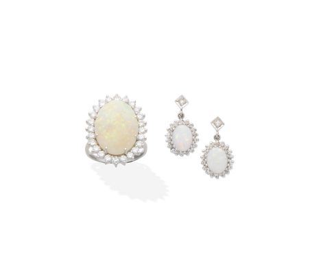 OPAL AND DIAMOND RING AND EARRINGS1st: The ring set with an opal cabochon within a brilliant-cut diamond surround, 2nd: Each 