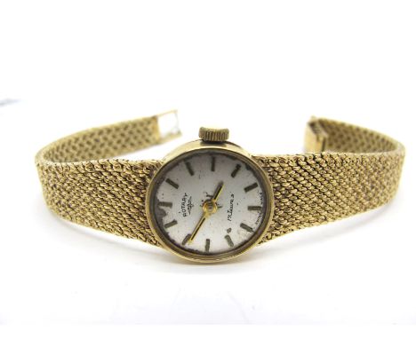 Rotary; A 9ct Gold Cased Ladies Wristwatch, (lacking glass) to integral tapering textured bracelet, overall length 16.5cm. 
