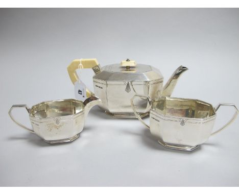 A Hallmarked Silver Three Piece Tea Set, HMS, Sheffield 1939, of Art Deco style, the tea pot with ivory handle and finial, to