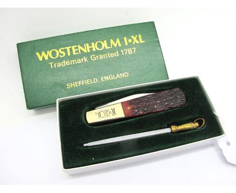 George Wostenholm IXL Single Blade Knife, with polished jigged stag scales, on long brass IXL bolster, with sharpening steel,