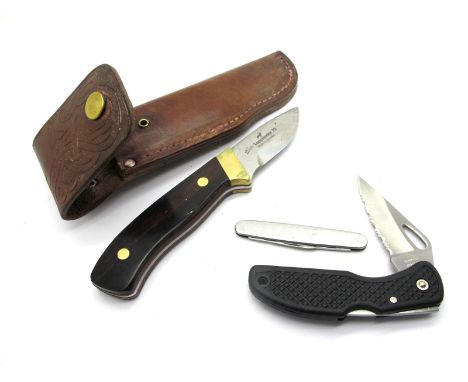 Lapplander 75 Made In Sweden Skinning Knife, wooden scales and brass tang, 19cm, in brown leather sheath; Eye Witness Two Bla
