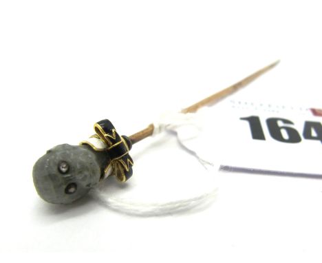 A XIX Century Novelty Carved Labradorite Monkey Head Stickpin, with inset eyes and black and white enamel collar and bow tie,