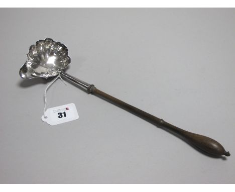 A Hallmarked Silver Toddy Ladle, (marks rubbed) the shaped bowl with side spout, initialled, with turned wooden handle, overa