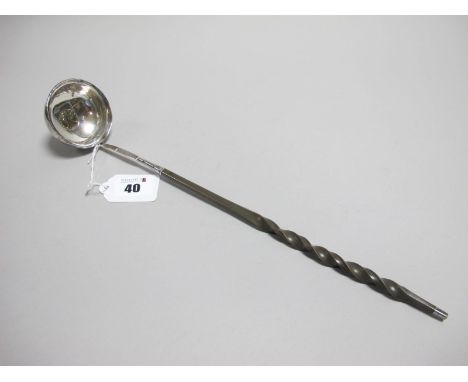 A Toddy Ladle, the plain circular bowl with inset 1703 Vigo Queen Anne sixpence, initialled, with twisted handle, overall len