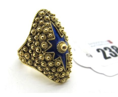 A Large Dress Ring, of shaped design, allover textured, highlighted in blue enamel (stamped "800") (finger size P). 