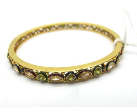 A Decorative Middle Eastern Bangle, with collet set highlights (two missing) and enamel detail, stamped "22KDM", (internal di