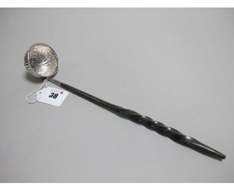 A Decorative Toddy Ladle, the allover decorated circular bowl inset with a 1758 George II shilling, with twisted handle, over