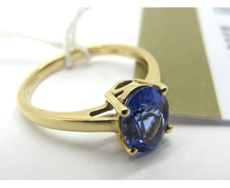 A 14ct Gold Tanzanite Single Stone Ring, oval four claw set (finger size N1/2). *Certificate of Authenticity states "1.42ct T