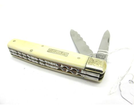 Clayton Pocket Knife, with ivory scales, etched brass bolster to one end, two blades, work back to spine and blades, brass wo