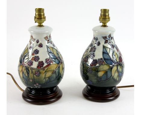 A pair of Moorcroft lamp bases of baluster form in blackberry bramble pattern, 20 cm excluding fittings .   