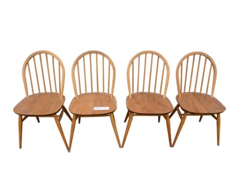 Set of four Ercol beech and elm stick back chairs, and four others similar, (8).   