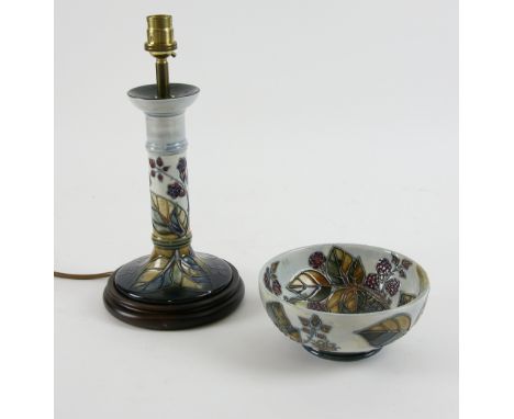 Moorcroft a candlestick form lamp base in blackberry bramble pattern, 21 cm excluding fittings and a bowl of the same pattern
