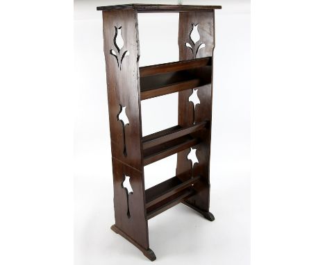 Early 20th century book trough in mahogany with pierced decoration .   