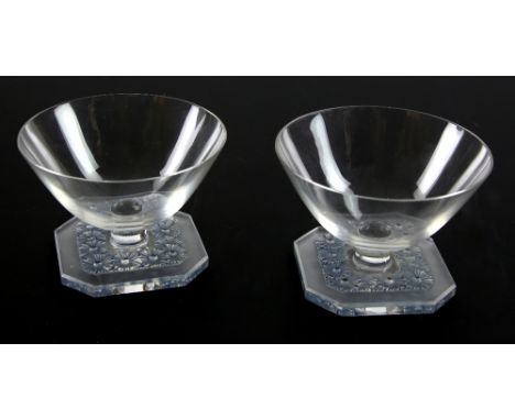Rene Lalique, a pair of blue stained Marguerites pattern drinking glasses, height 7cm.   Very light surface scratches.  No ot