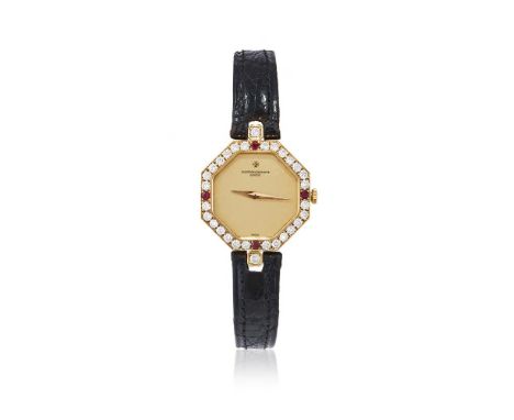 Y VACHERON CONSTANTIN, REF. 15526 A LADY'S 18 CARAT GOLD, DIAMOND AND RUBY WRISTWATCH, NO. 562869, CIRCA 1970Movement: Cal. 1