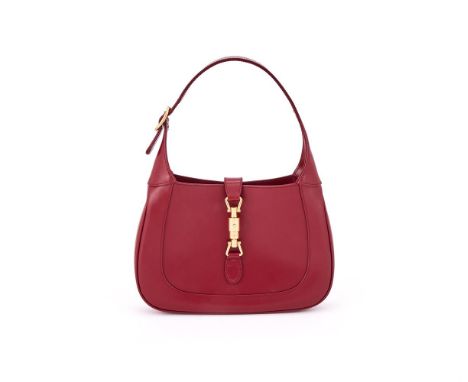 GUCCI, JACKIE 1961  A RED LEATHER HANDBAG With a red leather loop handle, detachable shoulder strap and piston fastener, open