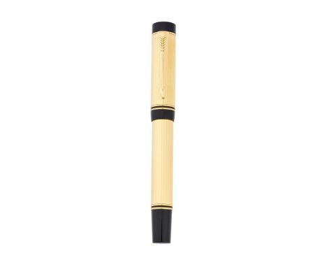 PARKER, DUOFOLD INTERNATIONAL  A GOLD PLATED FOUNTAIN PEN Cap and Barrel: Gold plated cap and barrel, the cap with an arrow c