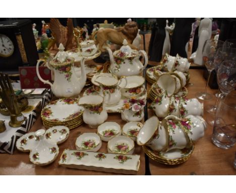 A good collection of Royal Albert 'Old Country Roses' tableware, tea pot, coffee pot, plates, cake plates, cups and saucers a