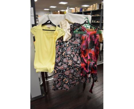 A mixed lot of ladies clothing, including vintage styles and modern brands.