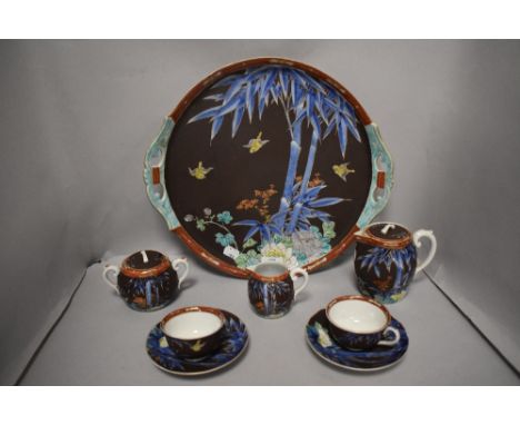 A Japanese Arita porcelain breakfast set, comprising of tray, two cups and saucers, sugar basin, creamer and tea pot, having 