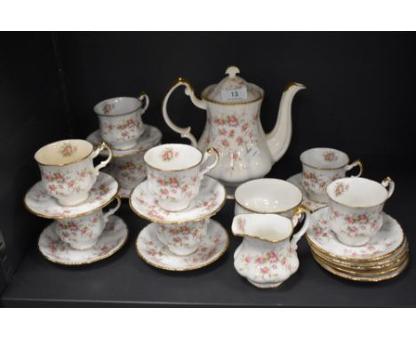 A mid century Paragon Victoriana Rose partial coffee service, comprising of coffee pot, cups and saucers, sugar basin and cre