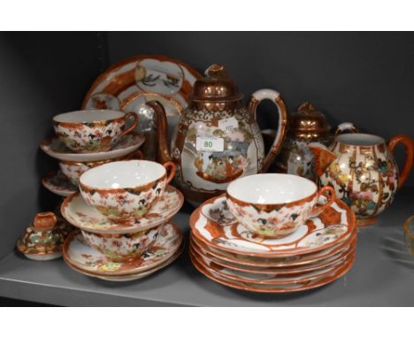 A vintage Japanese Satsuma partial tea service comprising of cups, saucers, tea pot plates and more.