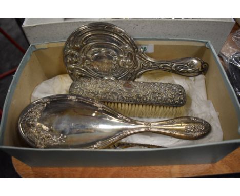 A group of three silver mounted dressing table wares, comprising hand mirror, hair brush, clothes brush and plated comb, vari