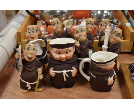 A collection of collectable novelty monk figurines and jugs, including Goebel with Bee back stamp.