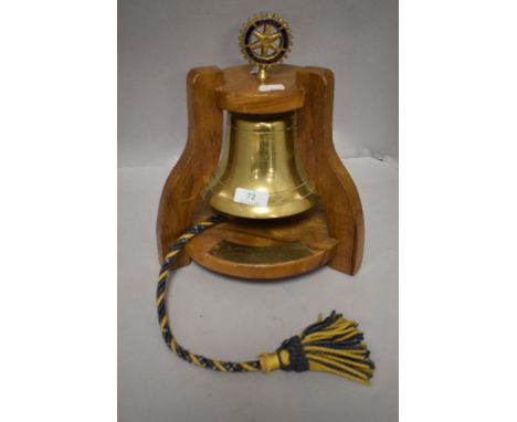 A memorial Rotary international presentation bell on wooden stand, in memory of John Kornelson, Dec 11th 1972.