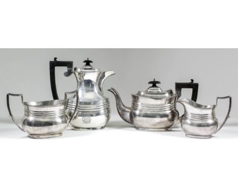 A George V silver rectangular four piece tea service with moulded rims, triple reeded band to bodies and reeded angular loop 