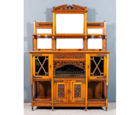 A late Victorian walnut side cabinet, the back inset with six bevelled mirrored panels (marked), fitted with a shelf, with fr