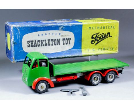 A Shackleton Toys tinplate clockwork model "Foden F.G." flatbed truck painted in green and red with key, spanner, maintenance